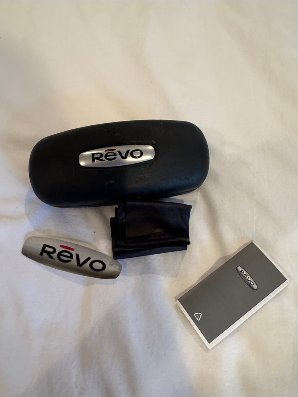 Revo Black and Silver Sunglasses Case with Cloth and Booklet